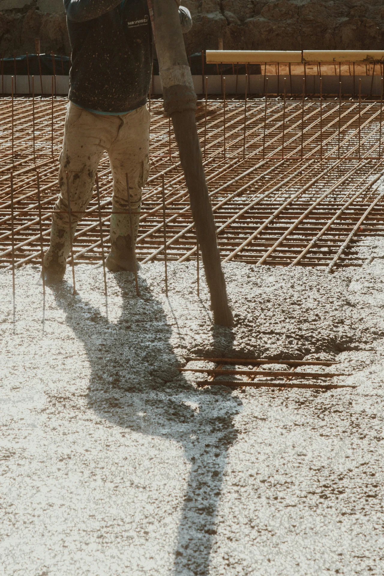 concrete pump hose placing concrete over a Pittsburgh rebar mat