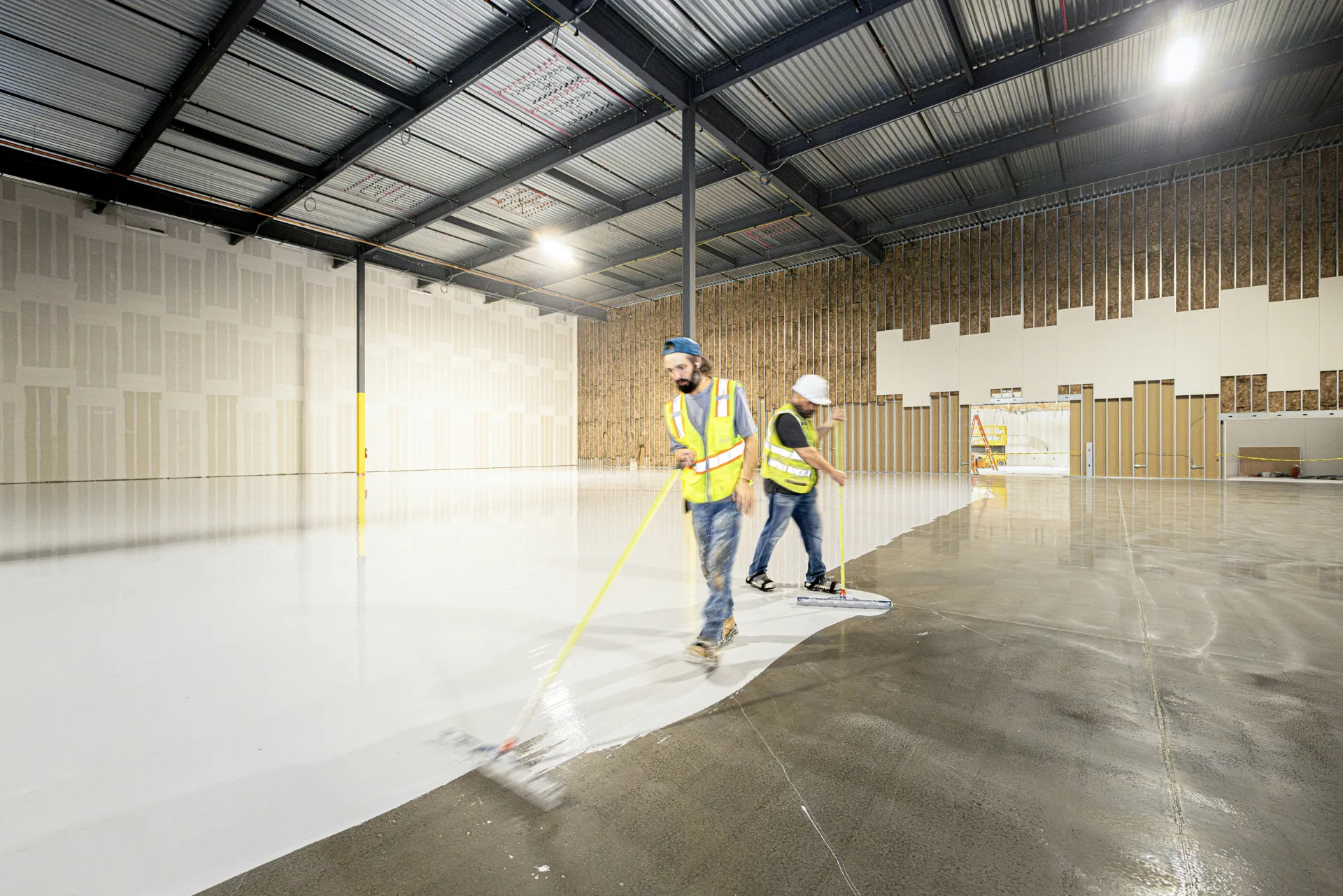 Rust-Oleum EpoxyShield being rolled onto a Pittsburgh concrete floor