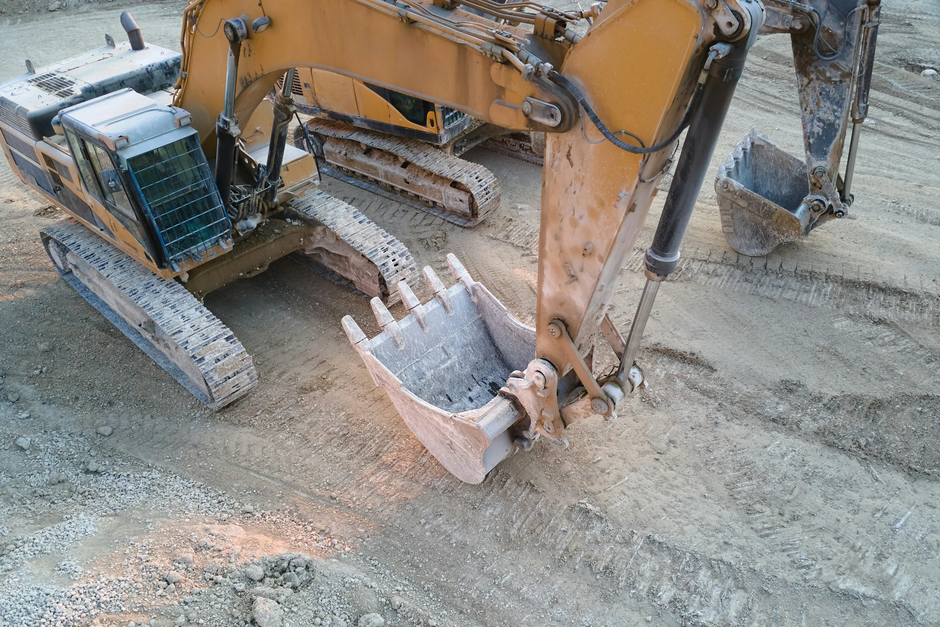 excavator working on a heavy-equipment concrete pad in Pittsburgh