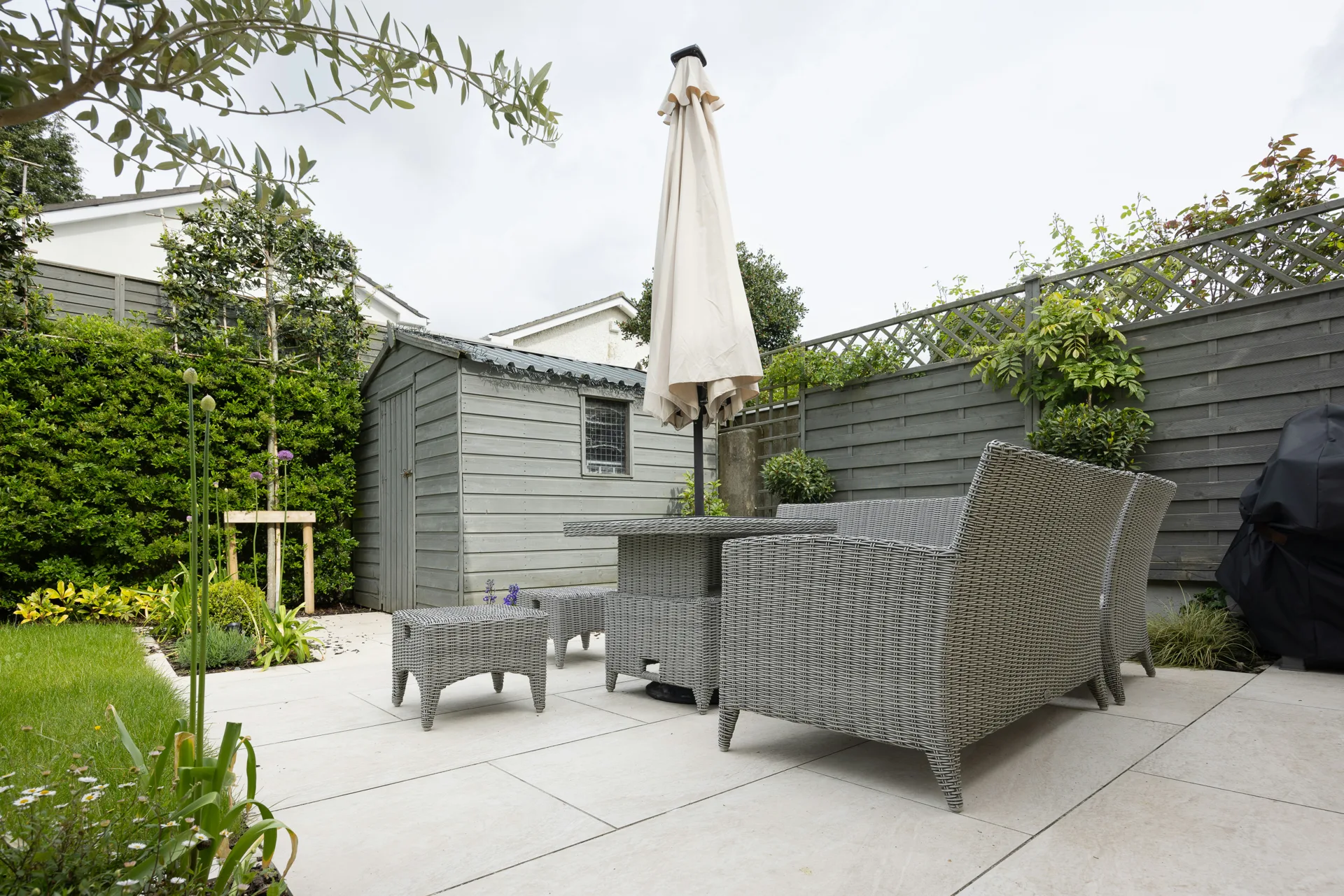 plain concrete patio in a Pittsburgh garden setting
