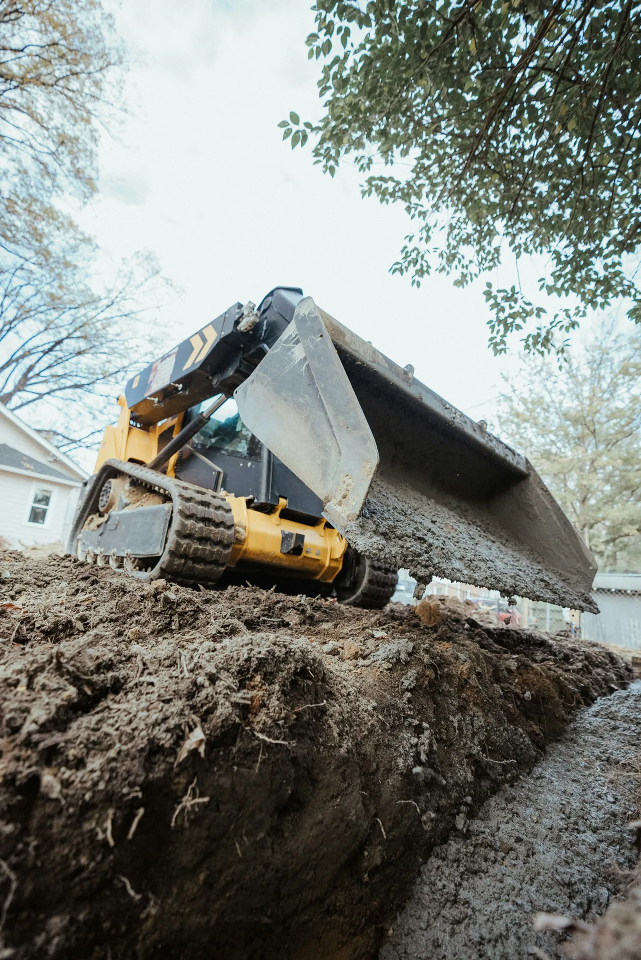 foundation repair pour with a track loader in Pittsburgh