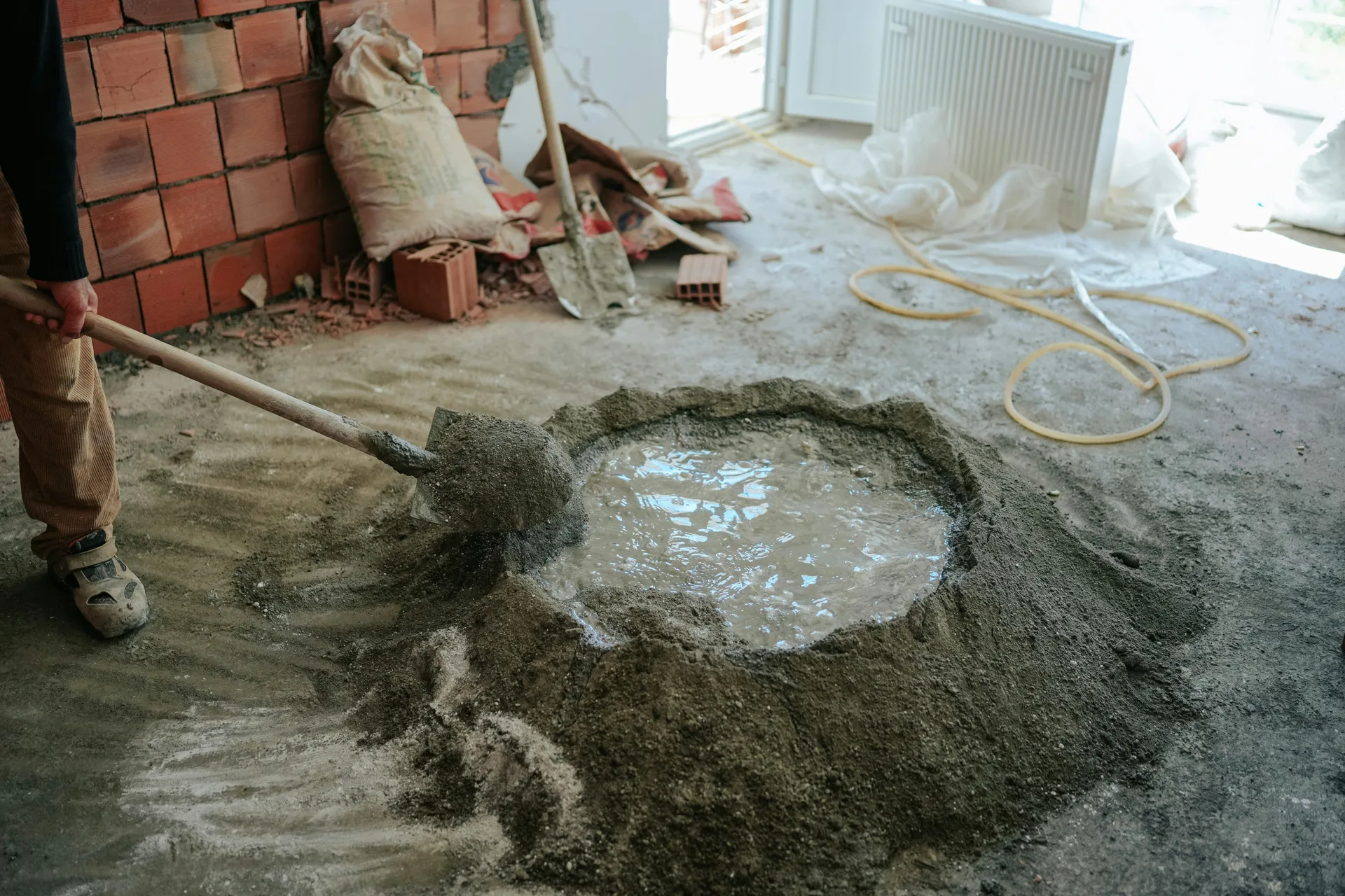 Mapei self-leveling compound being mixed on a Pittsburgh renovation site