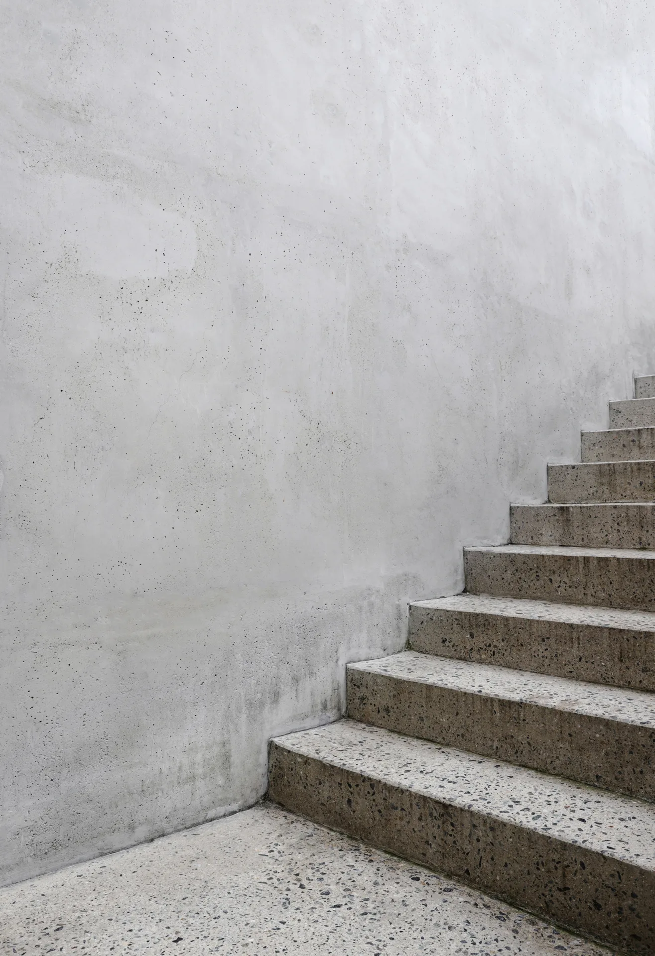 finished concrete front entry steps at a Pittsburgh home in winter