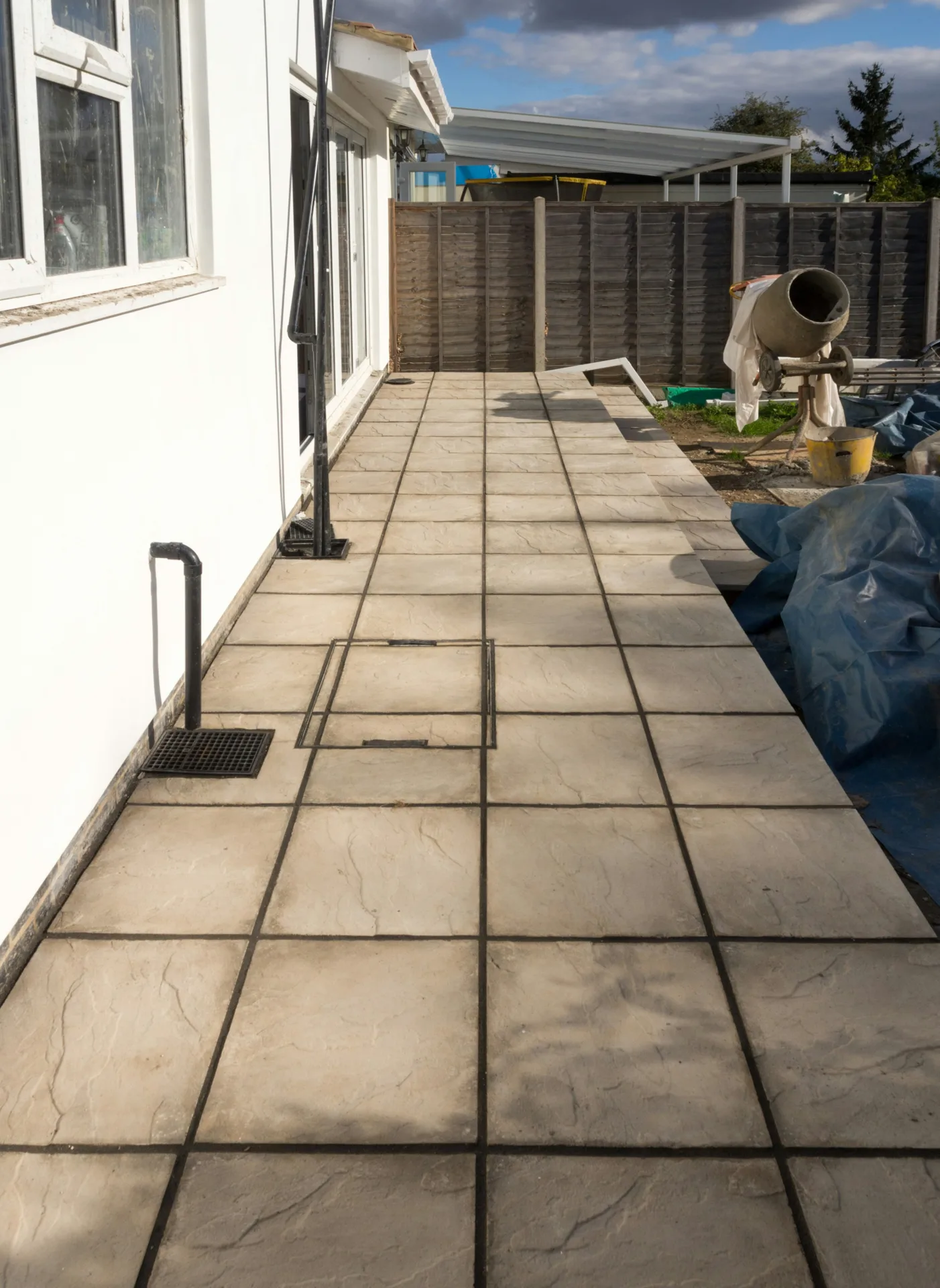 concrete walkway installation along the side yard of a Pittsburgh home